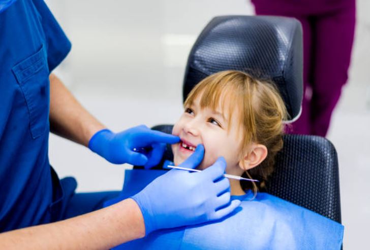 Little girl in dentist chair dental exam
